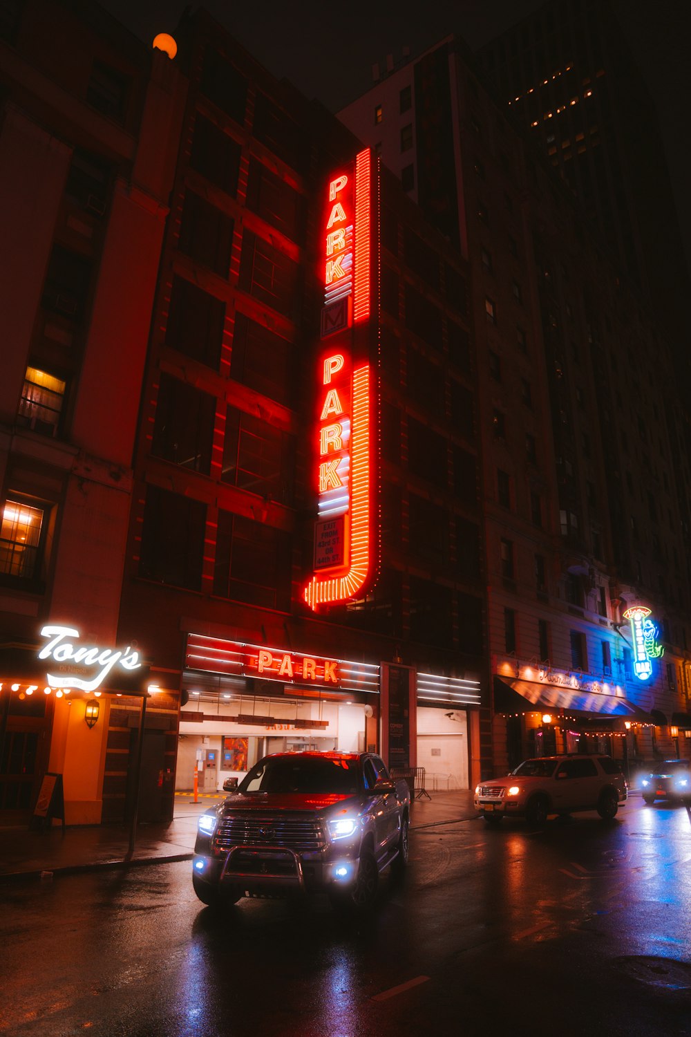 a neon sign on the side of a building