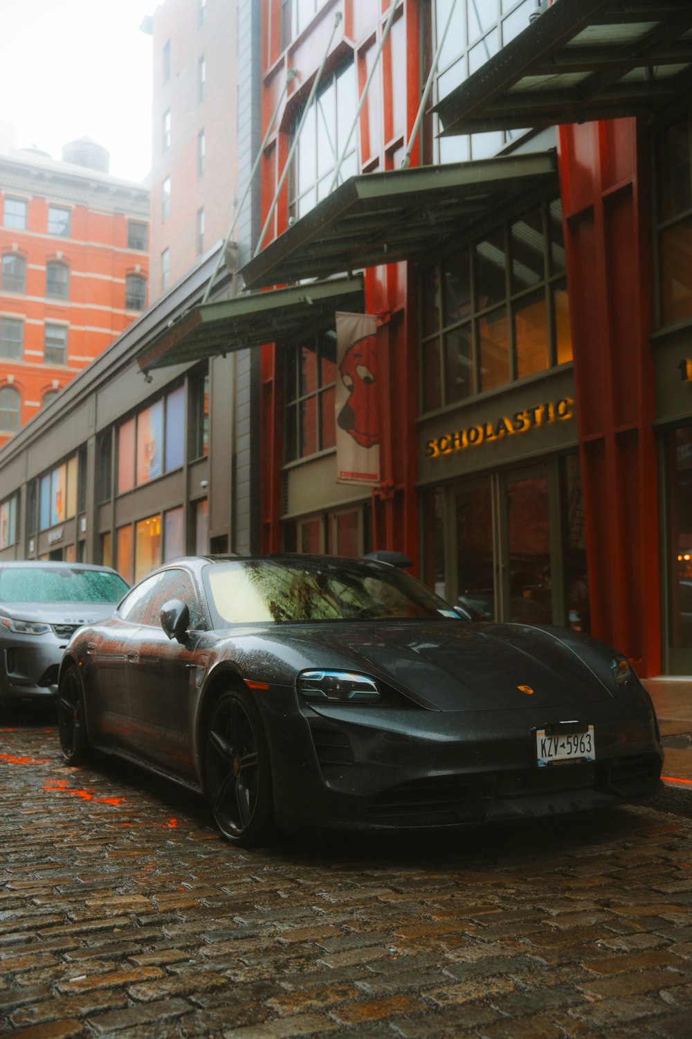 a black sports car parked on the side of a street