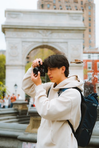 a person taking a picture with a camera