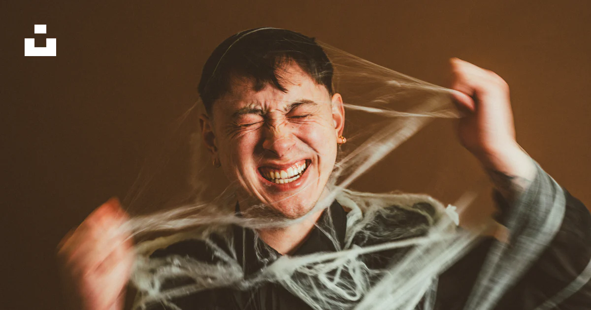 A man with a string wrapped around his face photo – Free Grey Image on ...