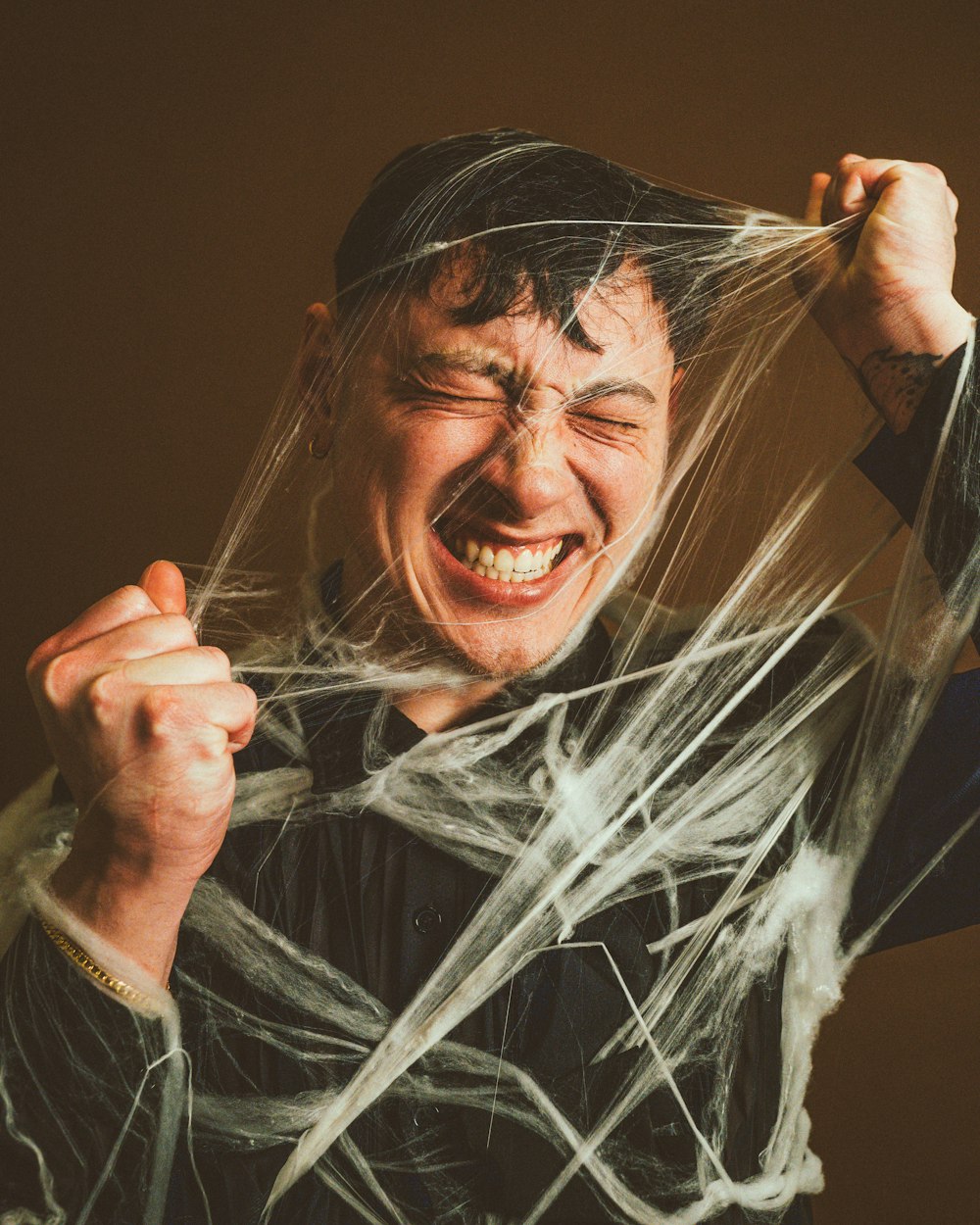 a man holding a string over his head