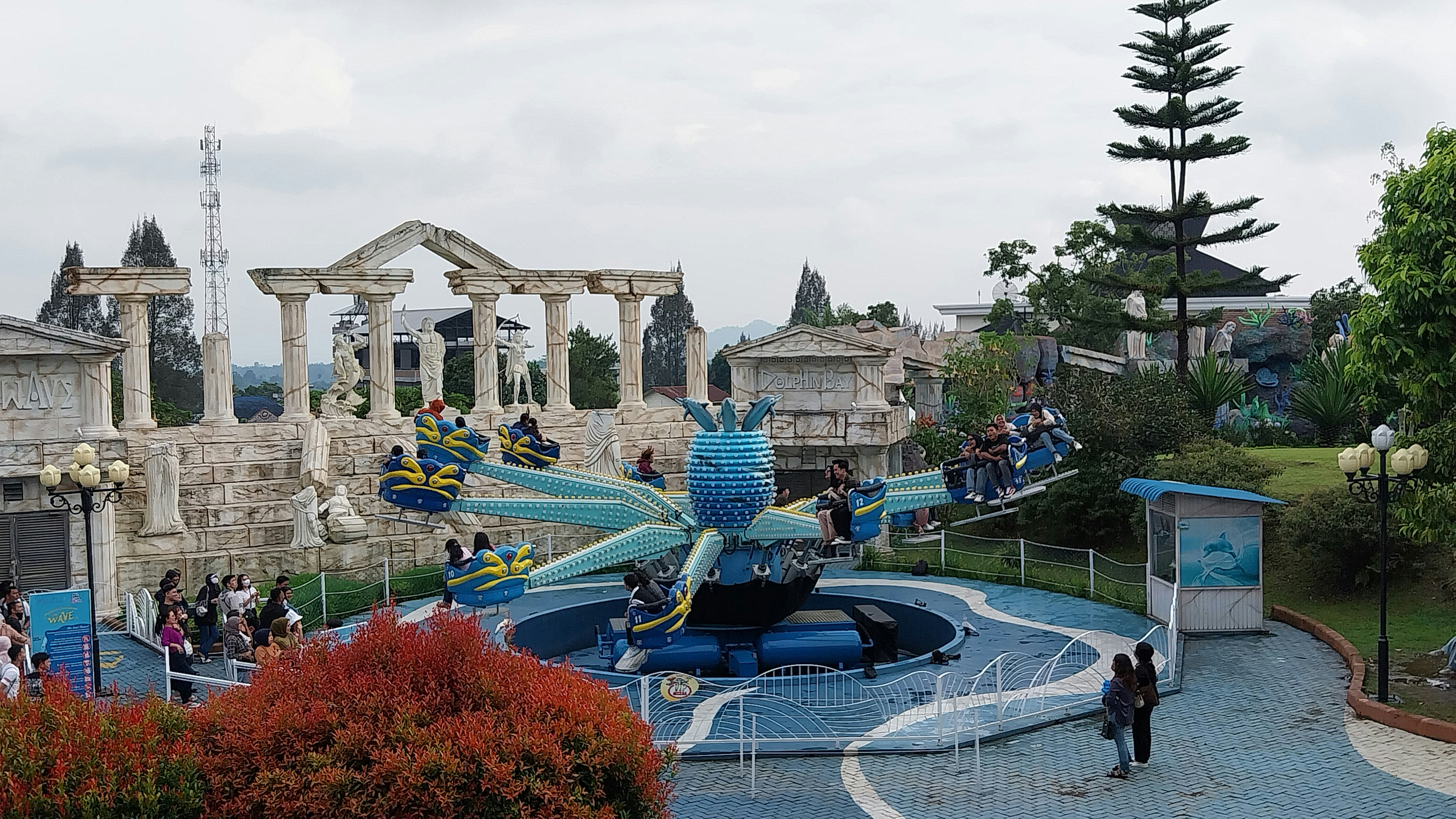 a water park with people riding roller coasters