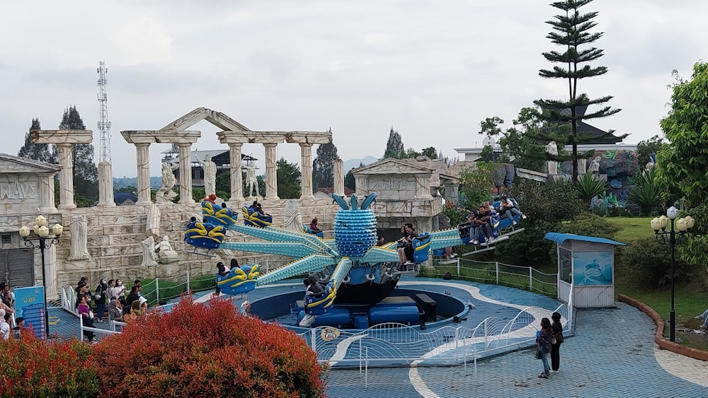 a water park with people riding roller coasters