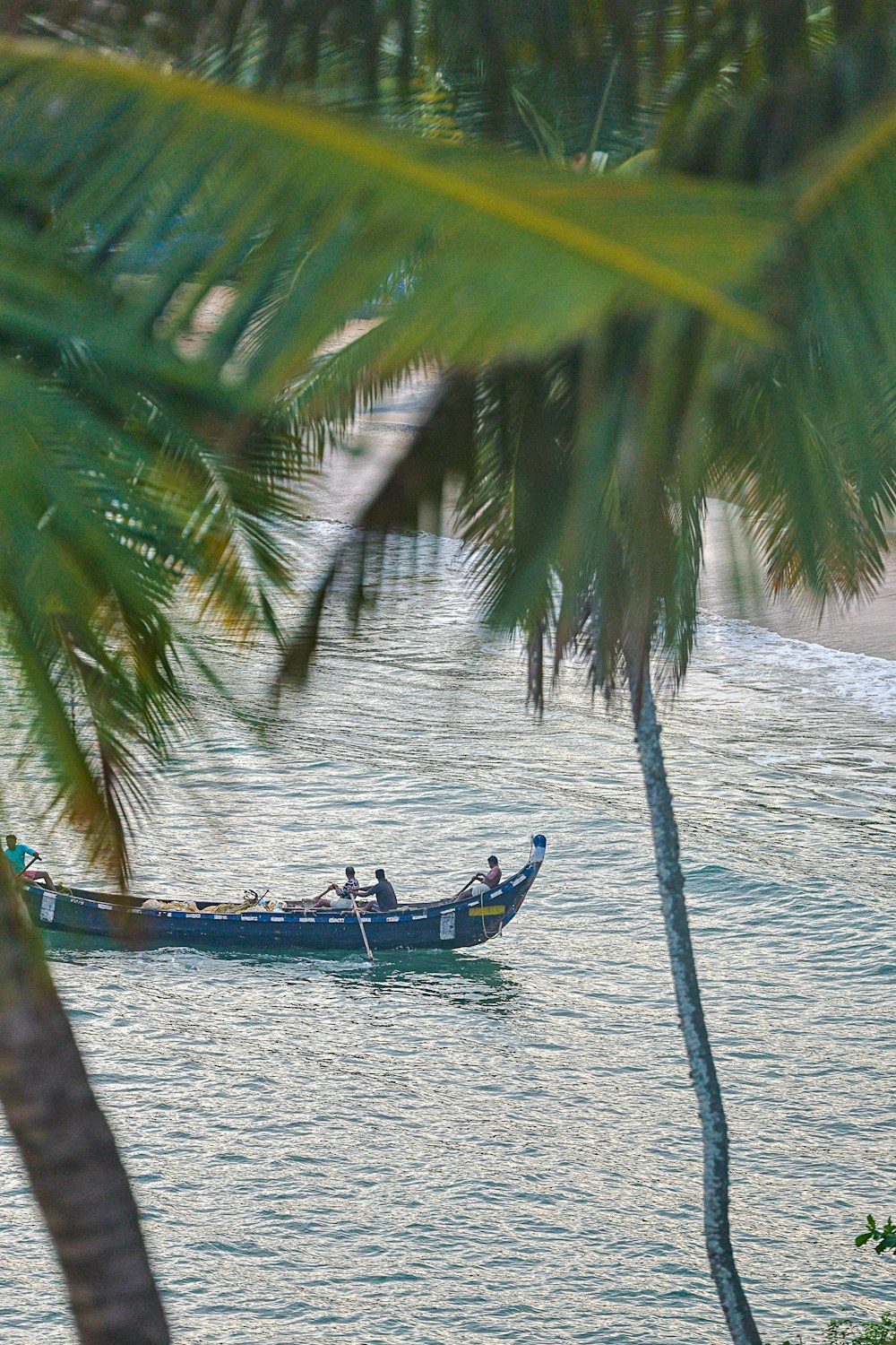 a boat with people in it on a body of water