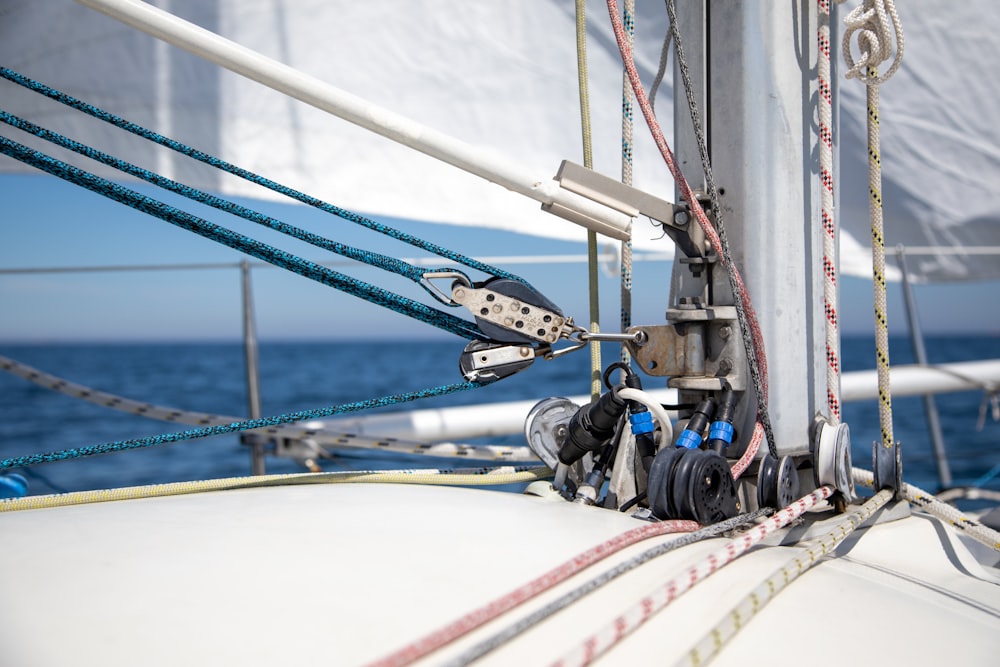 a close up of a sailboat's rig and ropes
