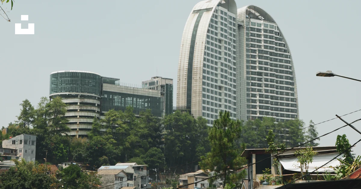 A view of a city with tall buildings photo – Free West java Image on ...