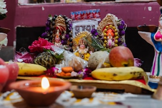 a statue of a person surrounded by fruits and vegetables
