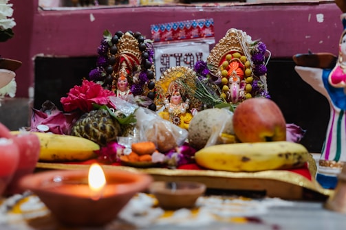 a statue of a person surrounded by fruits and vegetables