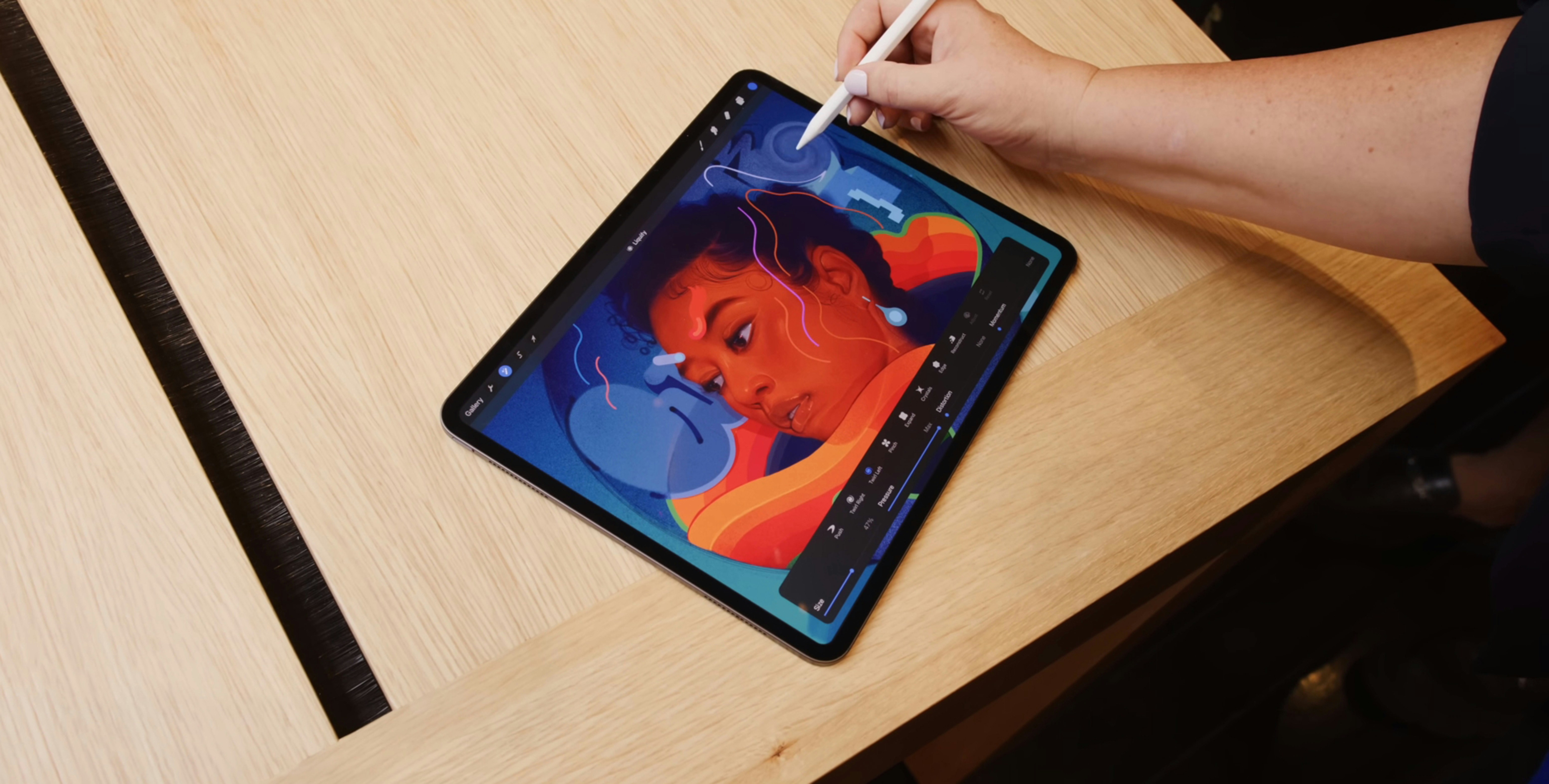 Digital art tablet with colorful character illustration in progress