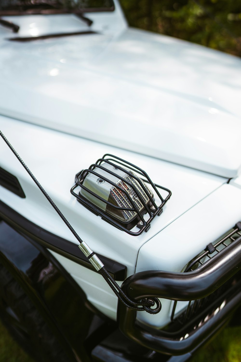 a close up of a white truck with a grill