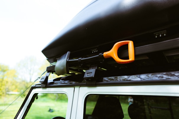 a car with a surfboard on top of it
