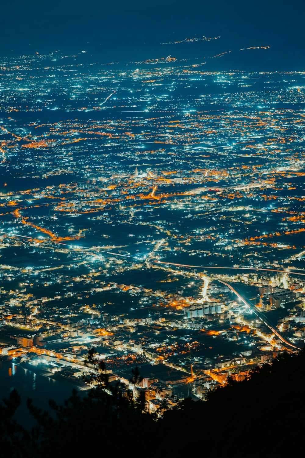 a view of a city at night from an airplane
