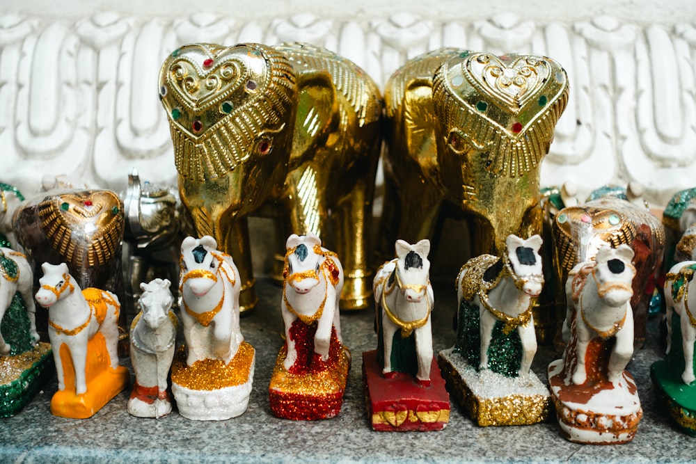 a group of small figurines of animals on a table