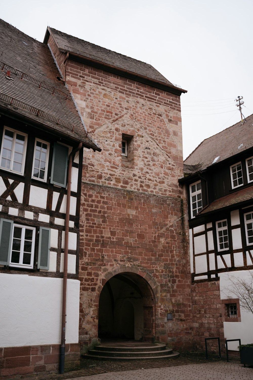 an old building with a clock on the front of it