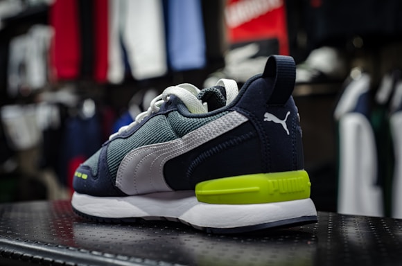 a close up of a shoe on a shelf