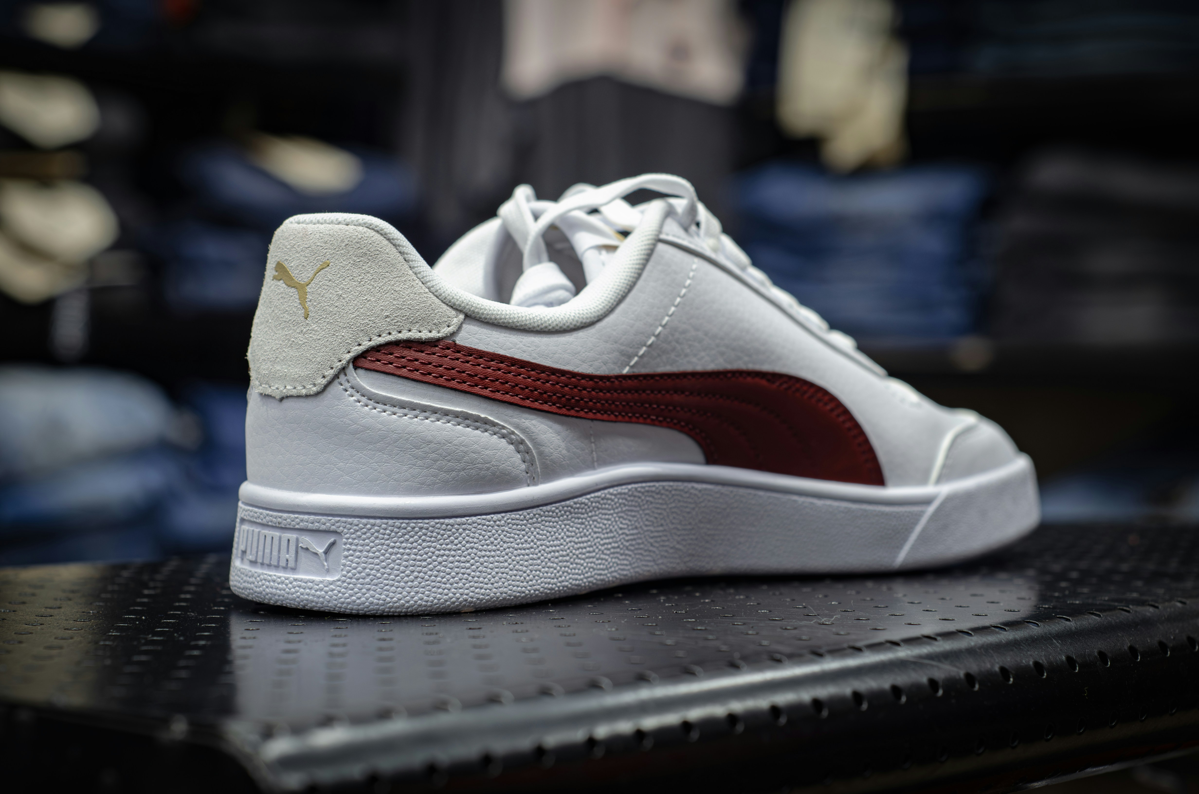 a white and red sneaker on top of a table