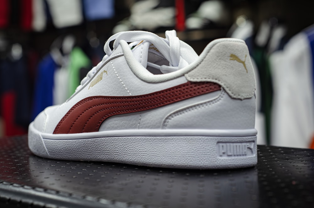 a white and red sneaker on a table