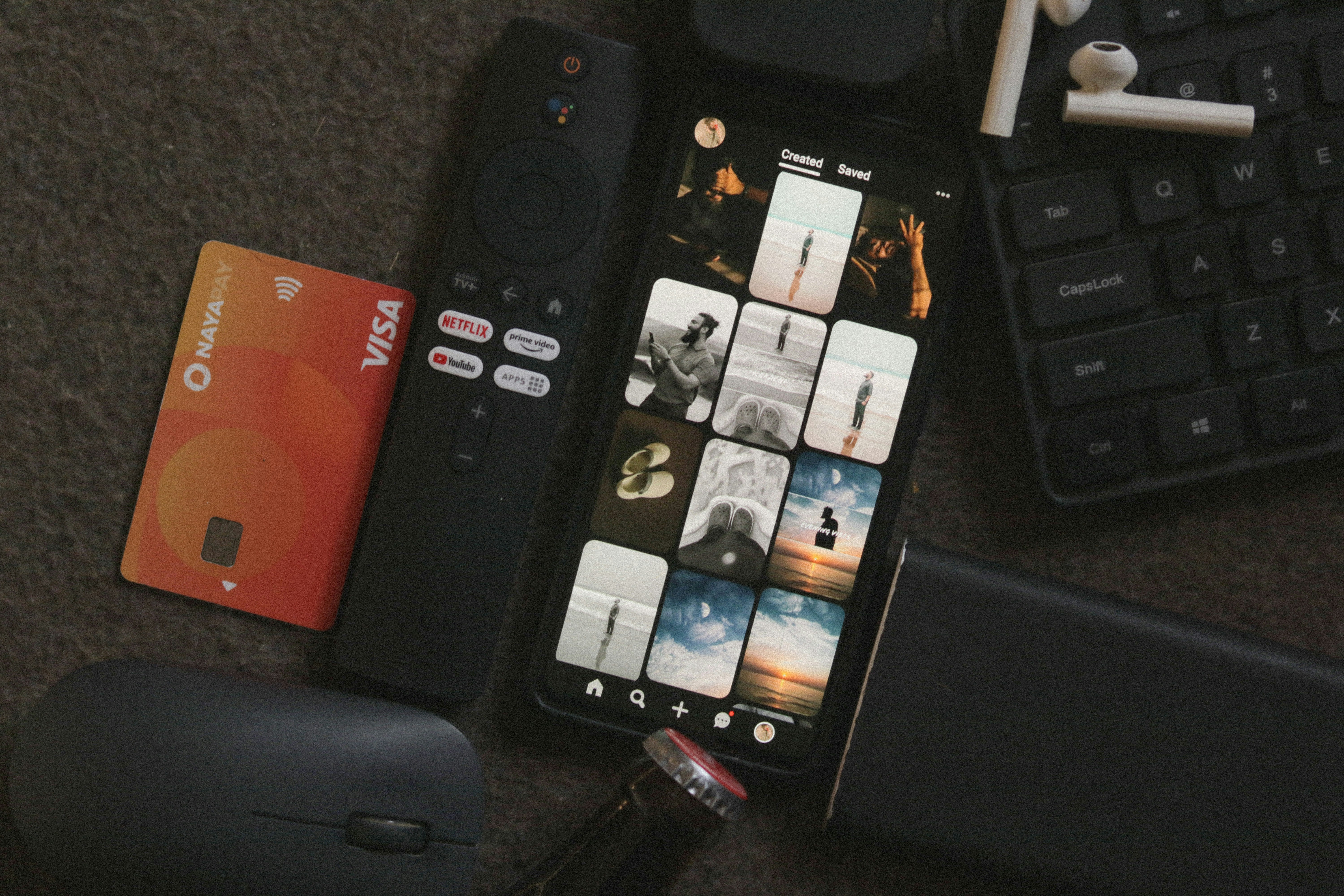 Social media content creation flat lay with phone, camera and creative props on dark textured surface