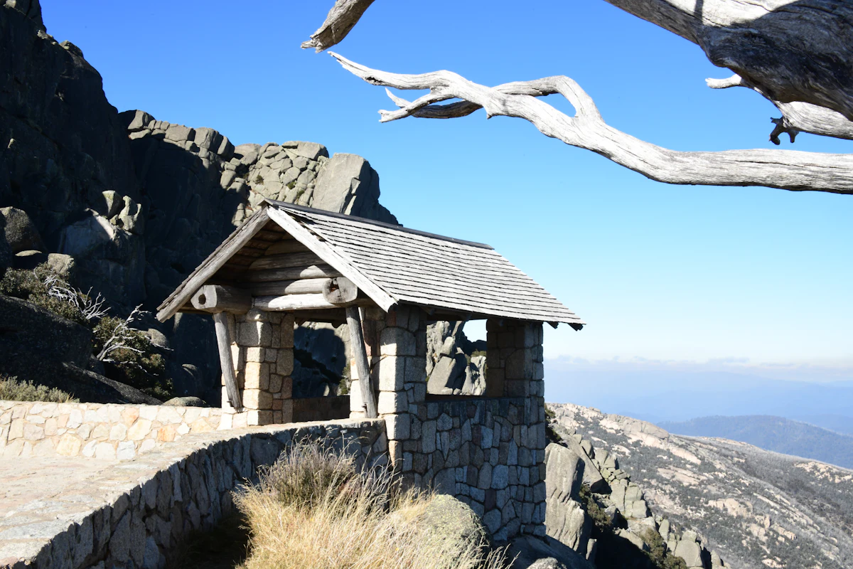 A stone and timber lookout shelter on granite at Mount Buffalo