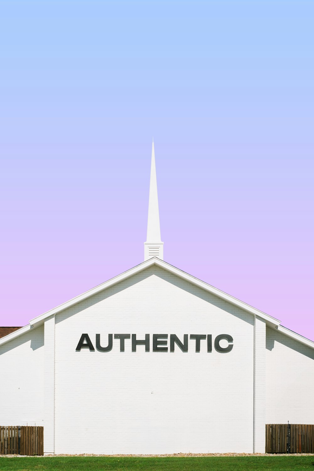 a white church with the word authentic on it