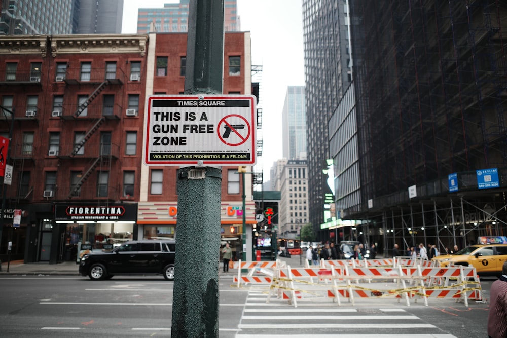 a sign warning of gun free zone on a city street