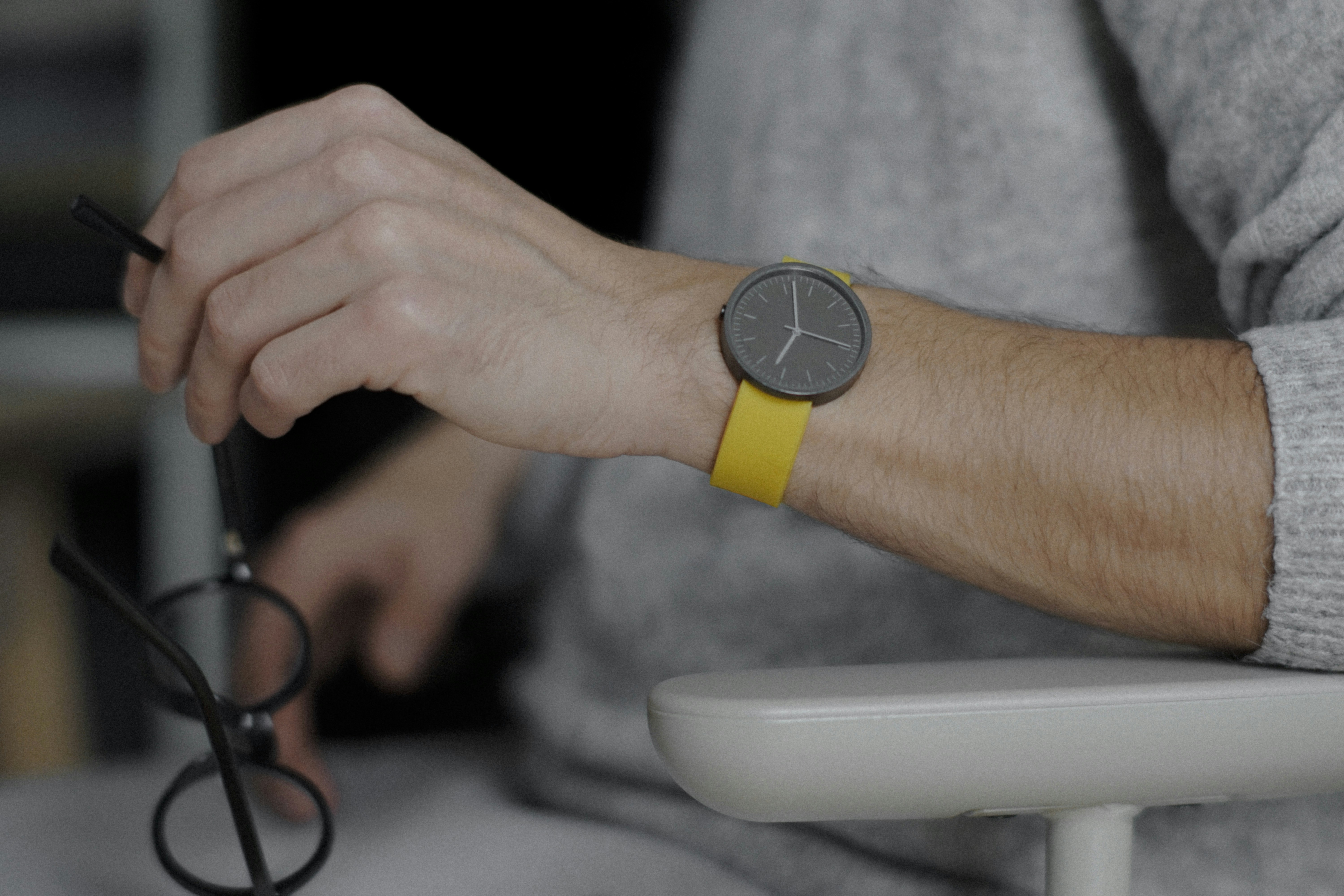 a close up of a person with a watch on their wrist