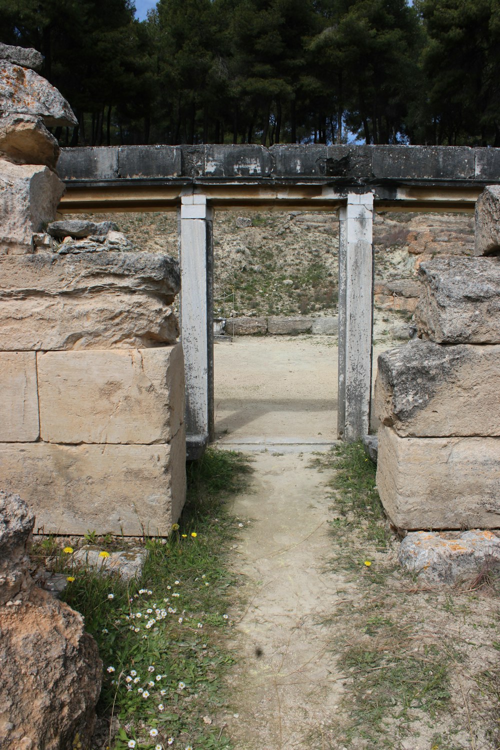 a stone structure with two doors in it