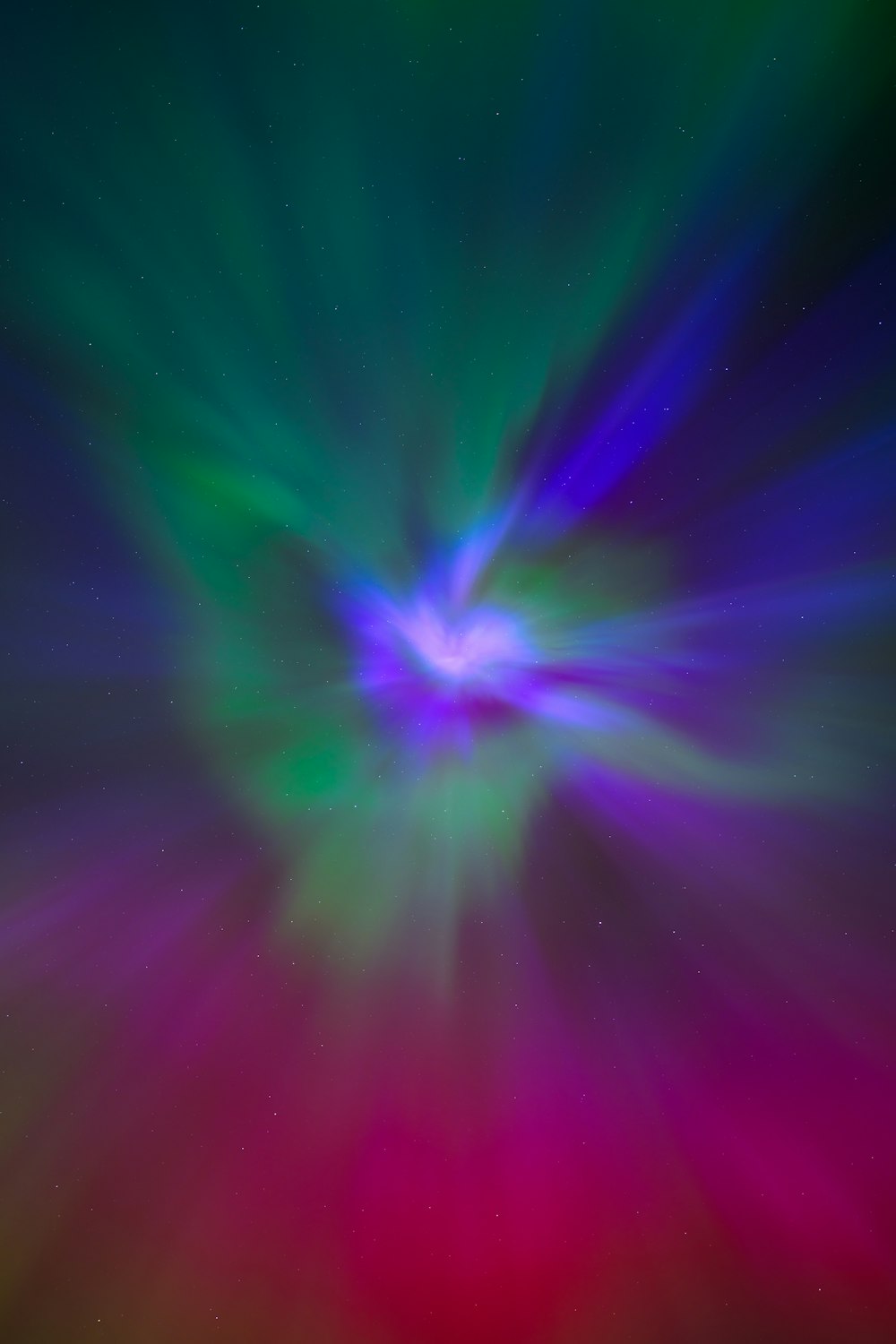 a colorful background with a star burst in the center