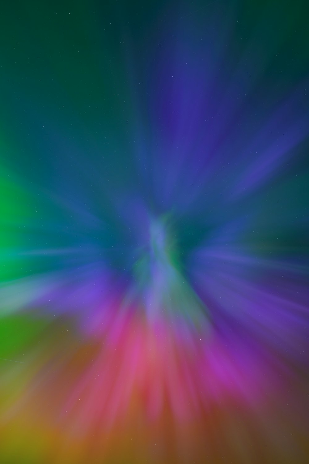 a blurry image of a green and purple background