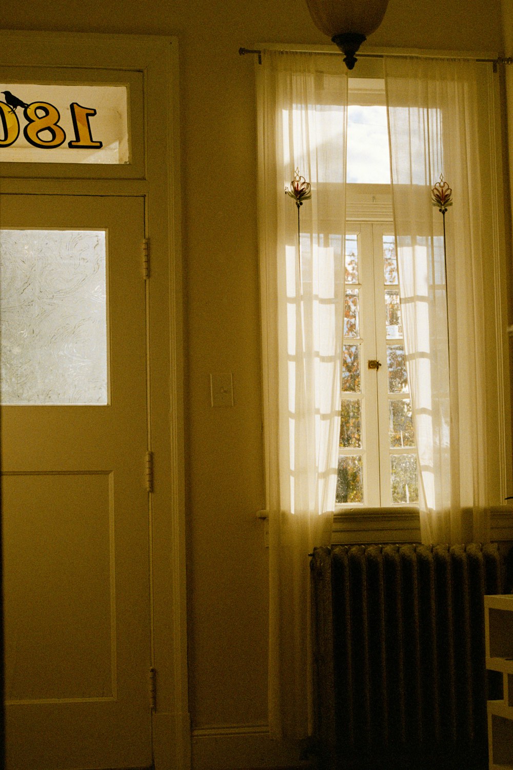 a room with a radiator and a window