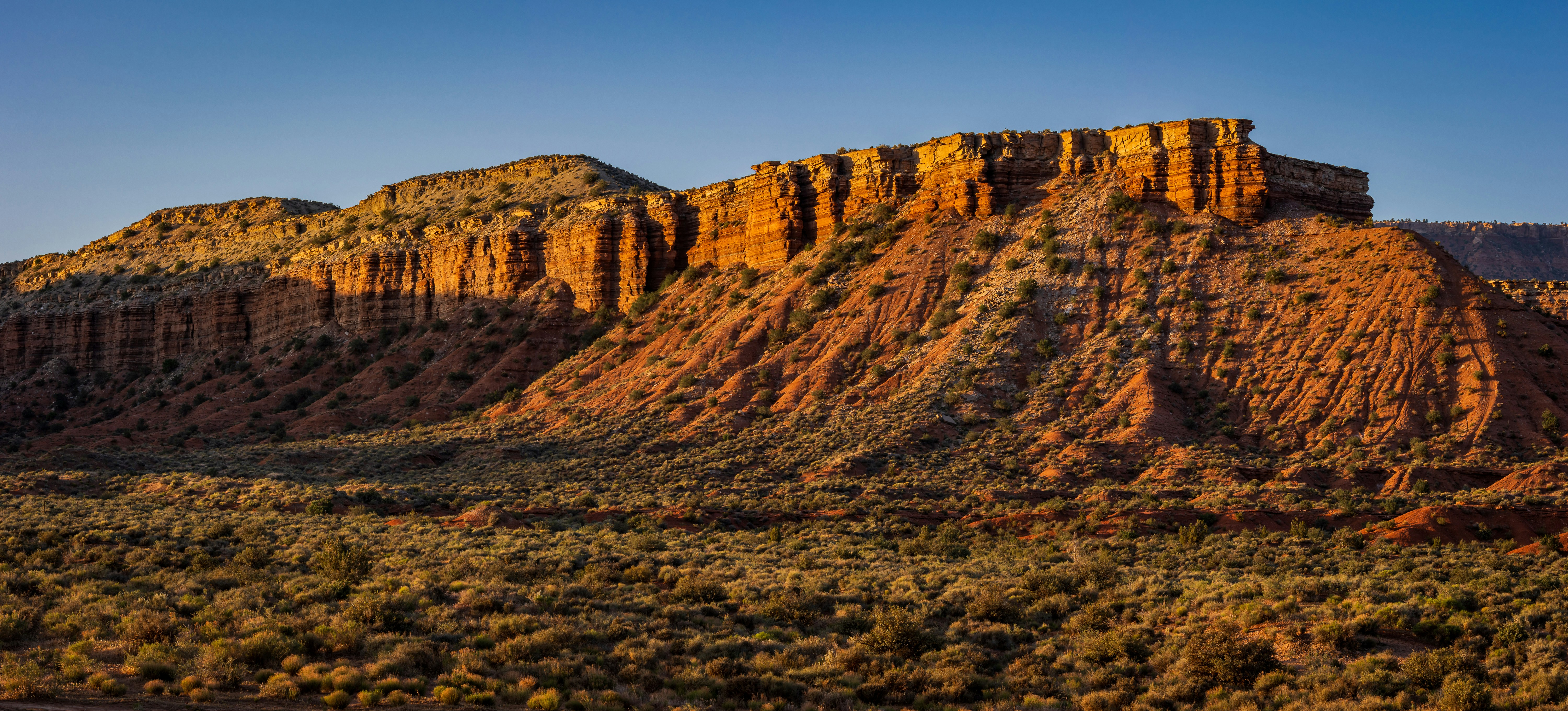 a large mountain with a very tall mountain in the background, 
