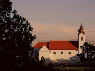 a large white building with a red roof