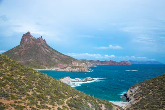 a view of a mountain and a body of water