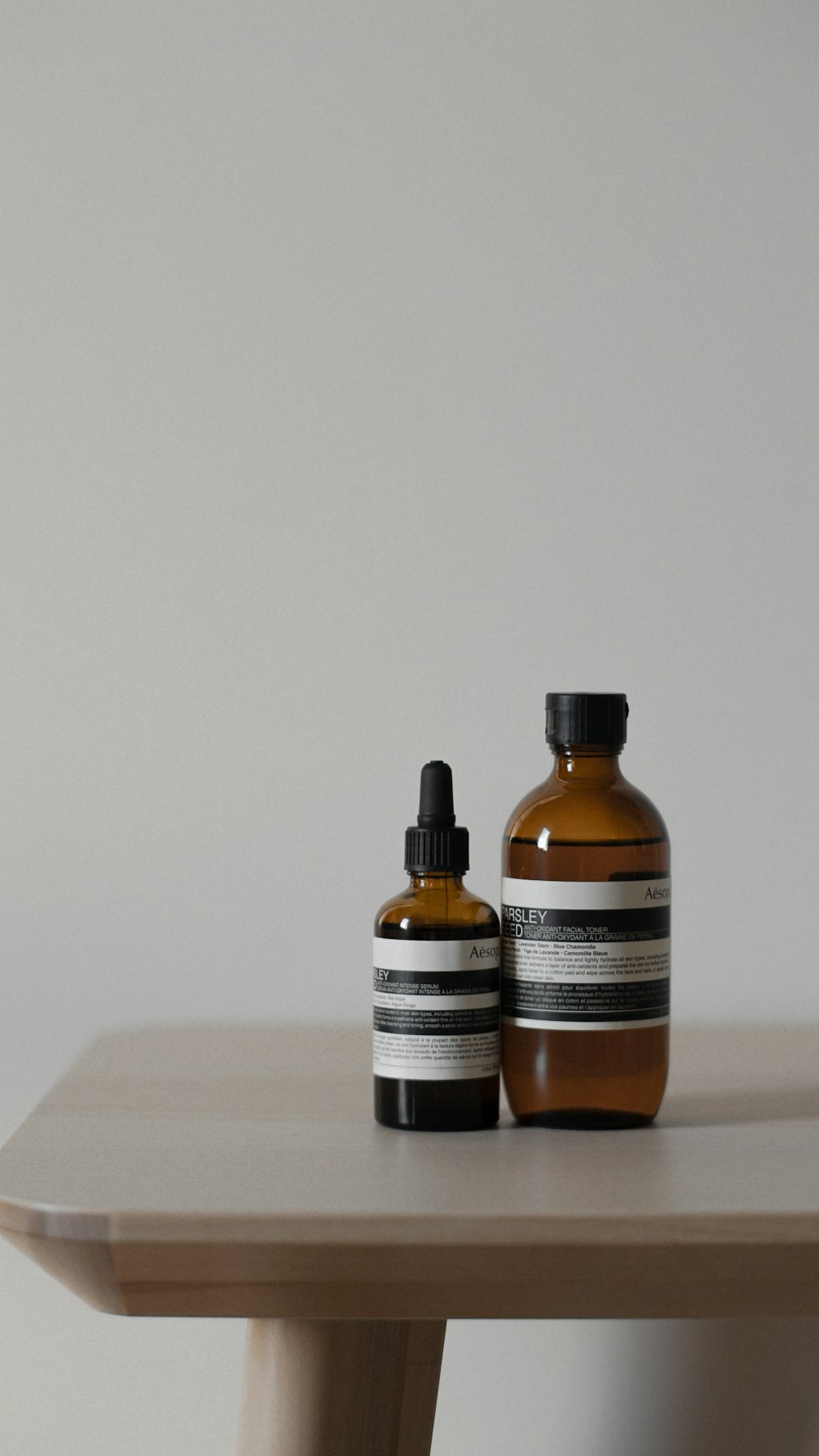 a couple of bottles sitting on top of a wooden table