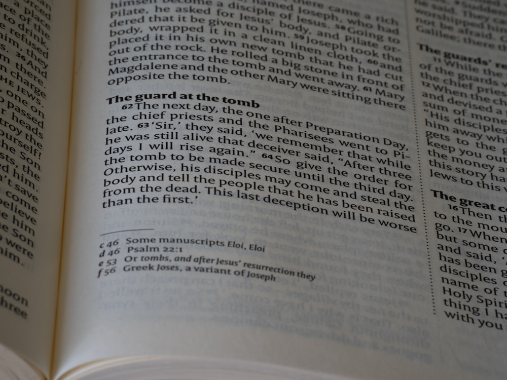 a close up of an open book on a table