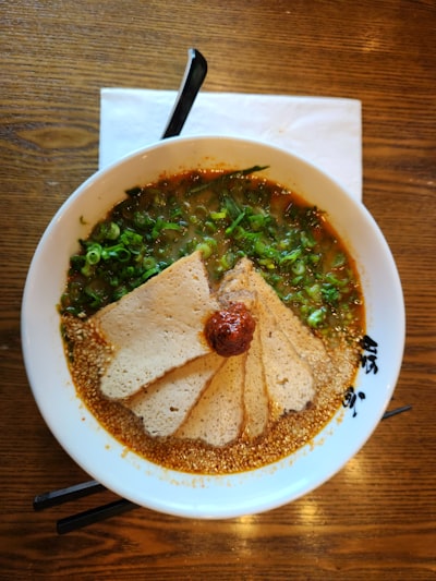 Bowl of lentil soup on a wooden table