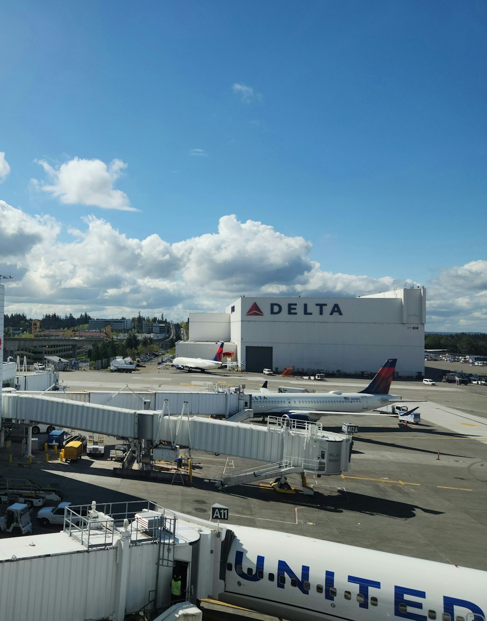 a large jetliner sitting on top of an airport tarmac