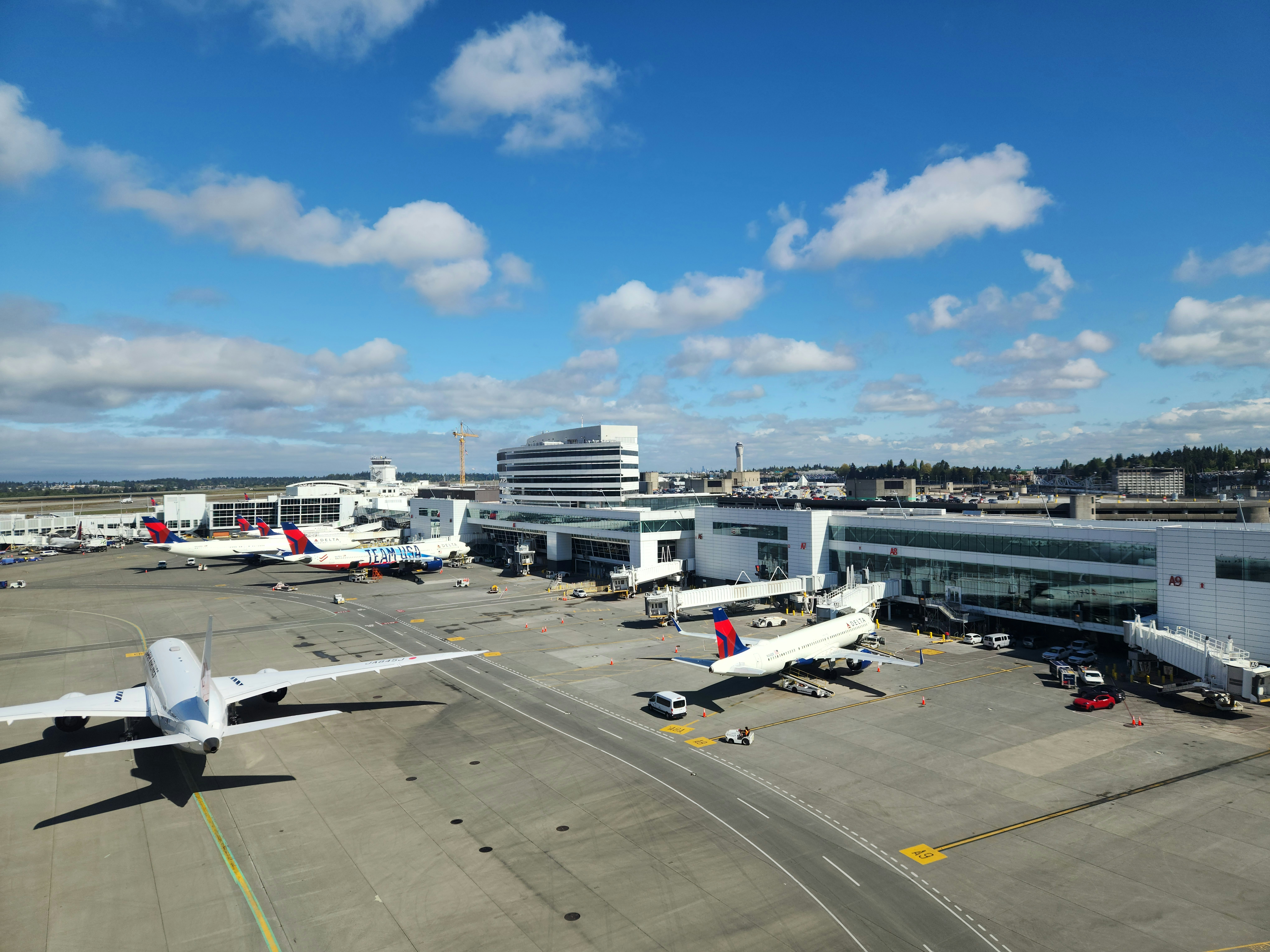 a large jetliner sitting on top of an airport tarmac, 