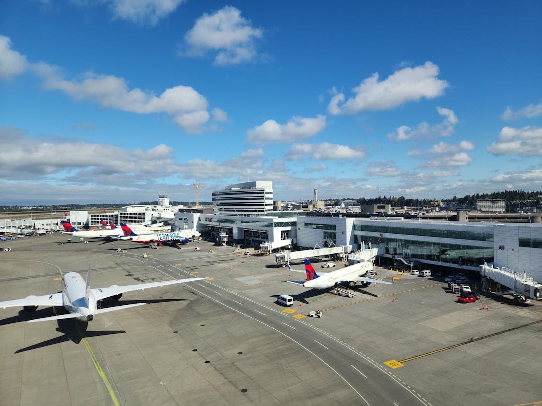 a large jetliner sitting on top of an airport tarmac,