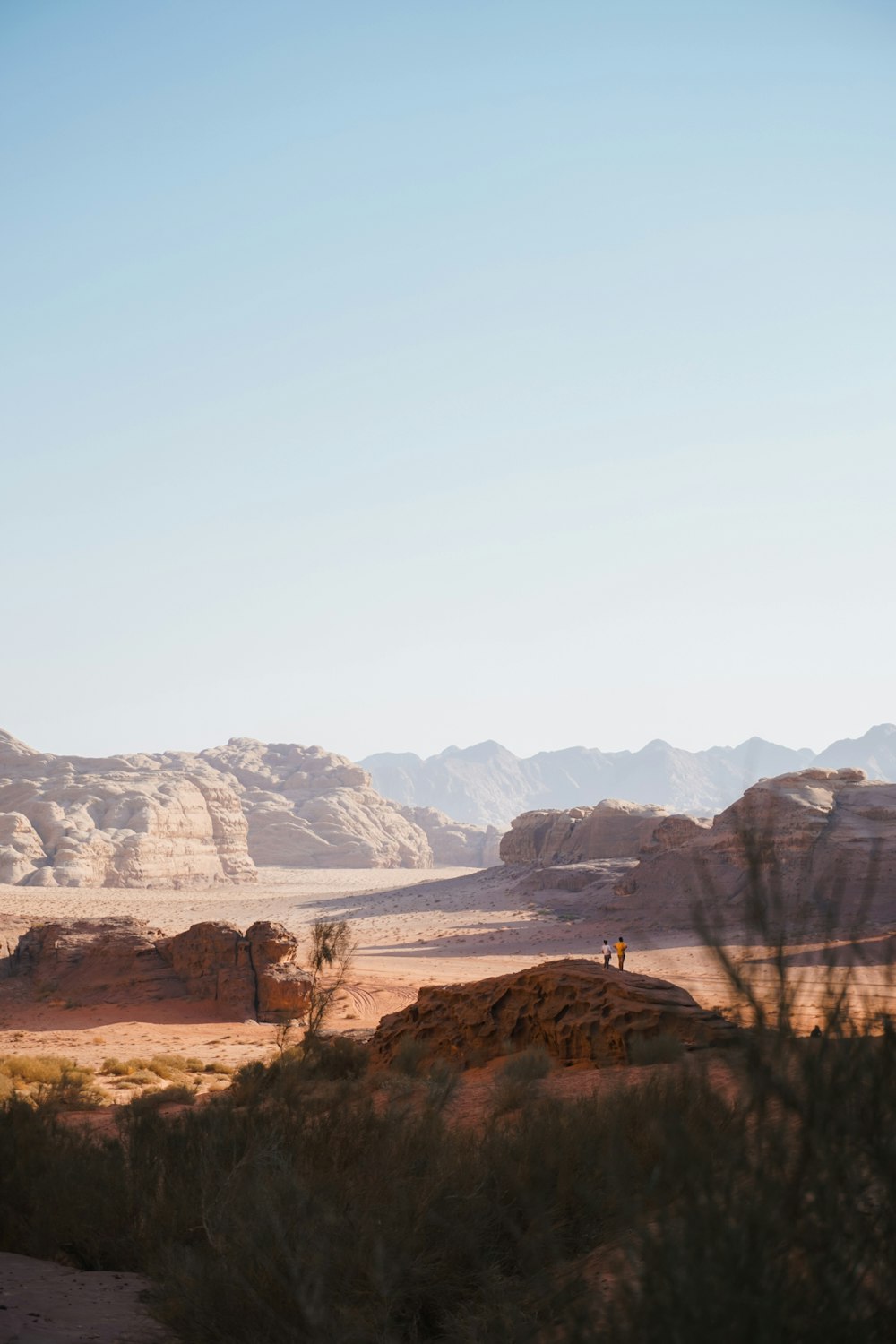 a person standing in the middle of a desert