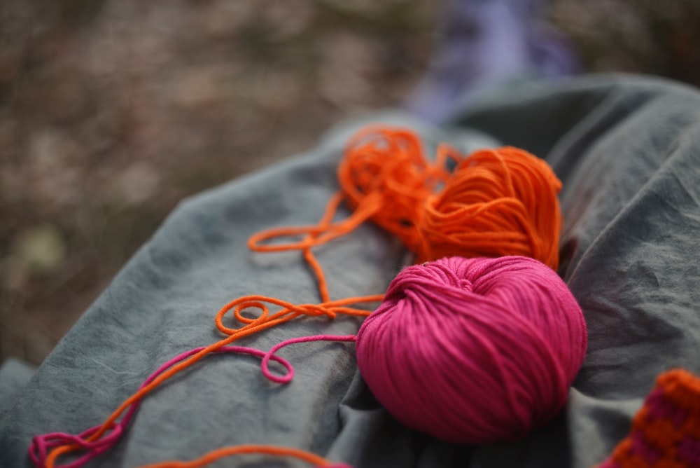 a ball of yarn and a ball of yarn on a blanket