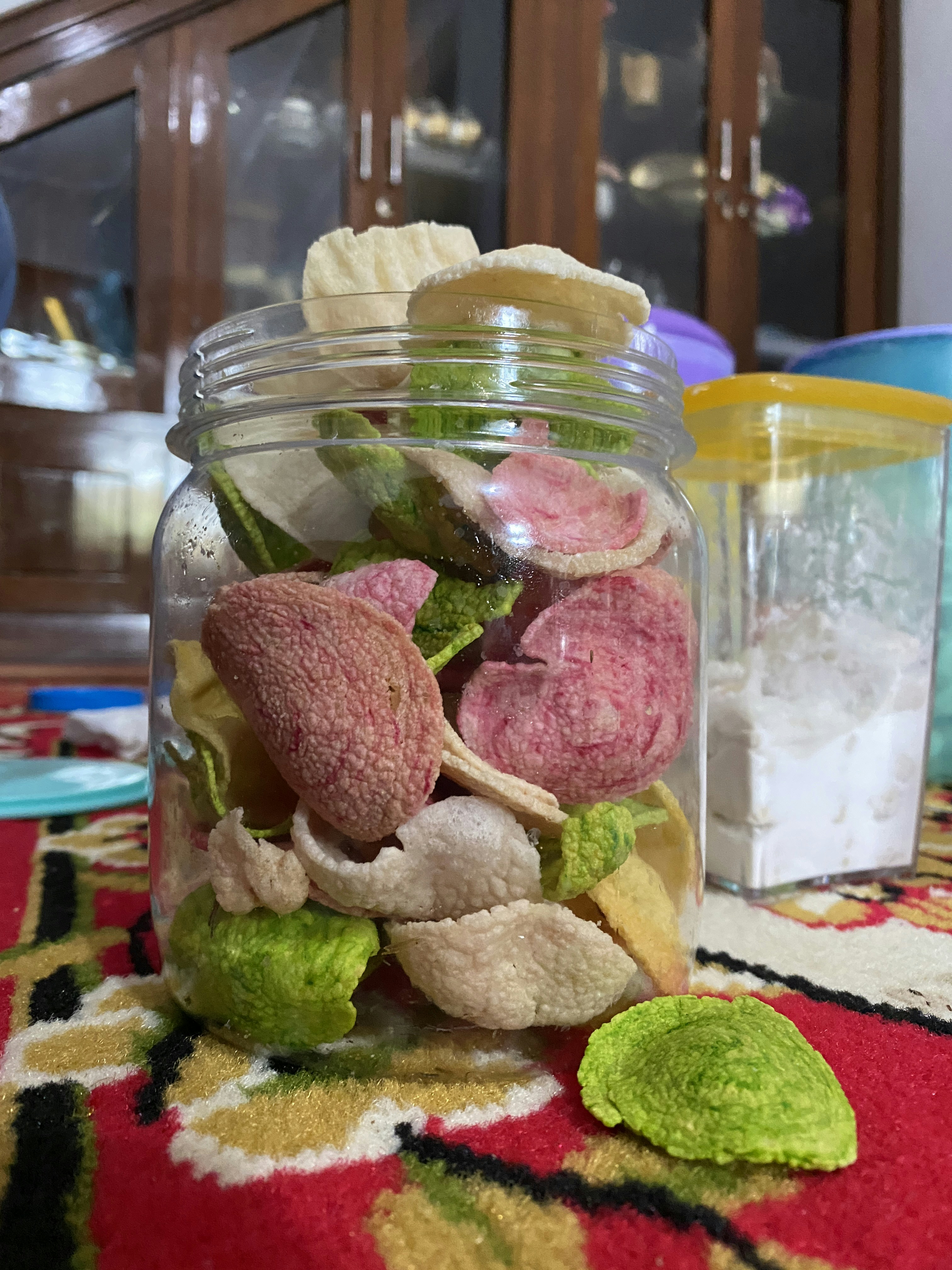 a glass jar filled with different types of food