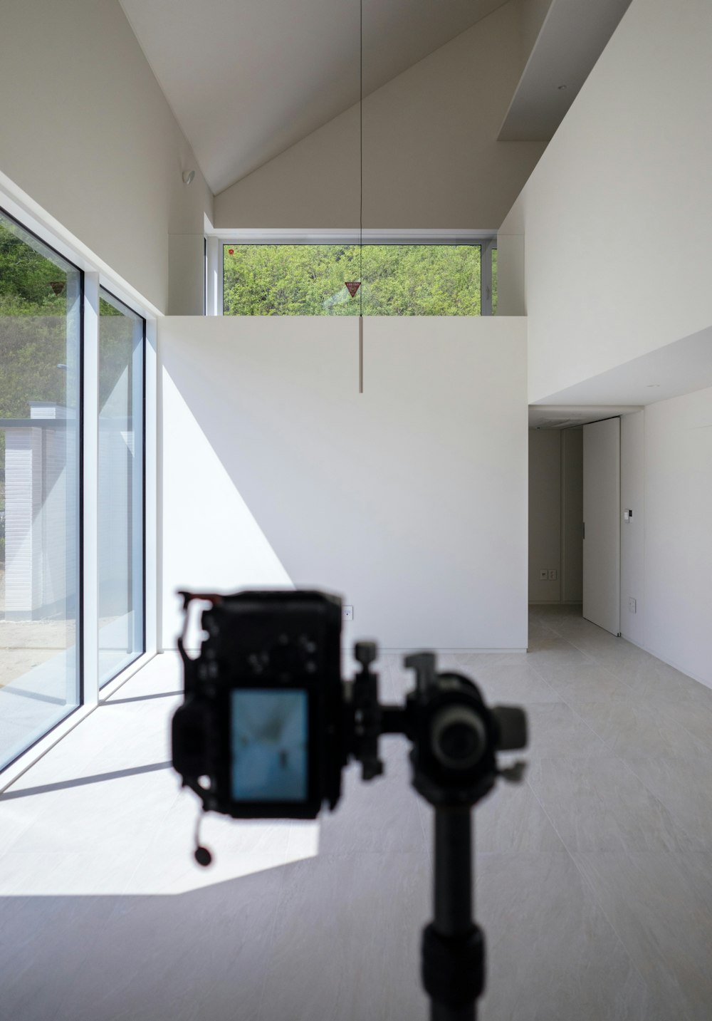 a camera is on a tripod in a room