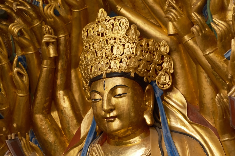 a golden statue of a person with a crown on