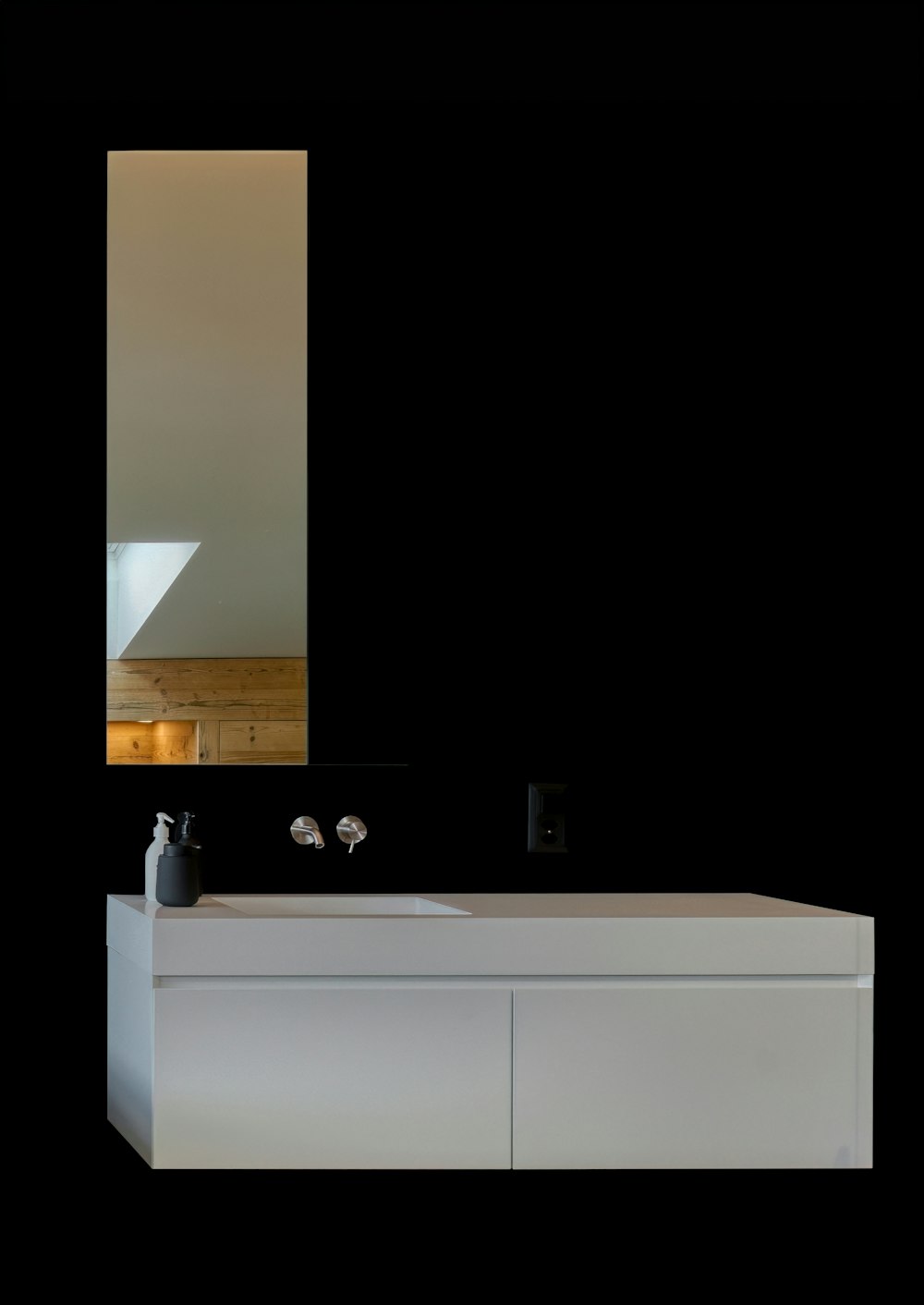 a white sink sitting under a mirror in a bathroom