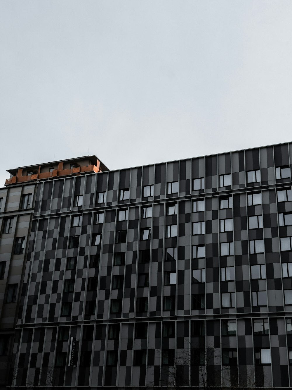 a tall building with lots of windows on top of it