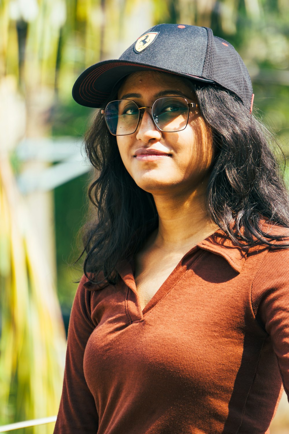 a woman wearing a hat and glasses