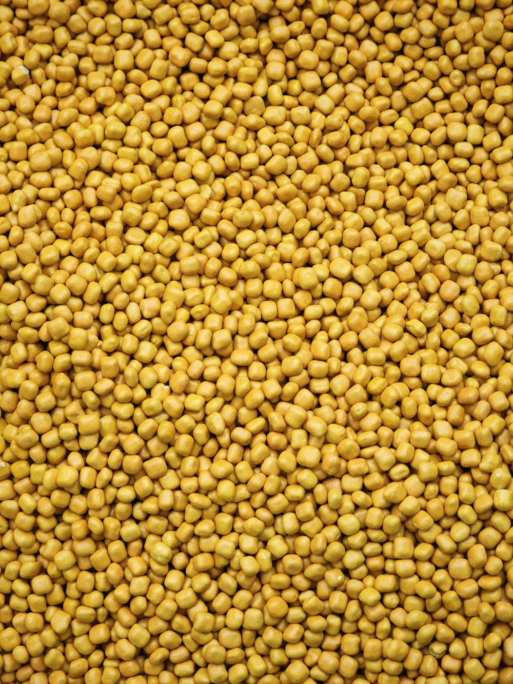 a close up of a bunch of yellow food
