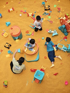 a group of children playing in a play area
