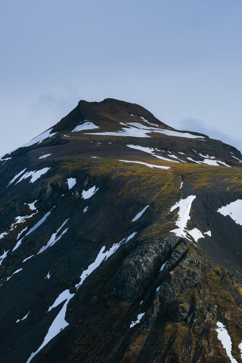 a very tall mountain covered in lots of snow